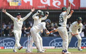 Australian players celebrate the dismissal of India's Ravindra Jadeja. Third Test, Indore, 2023.