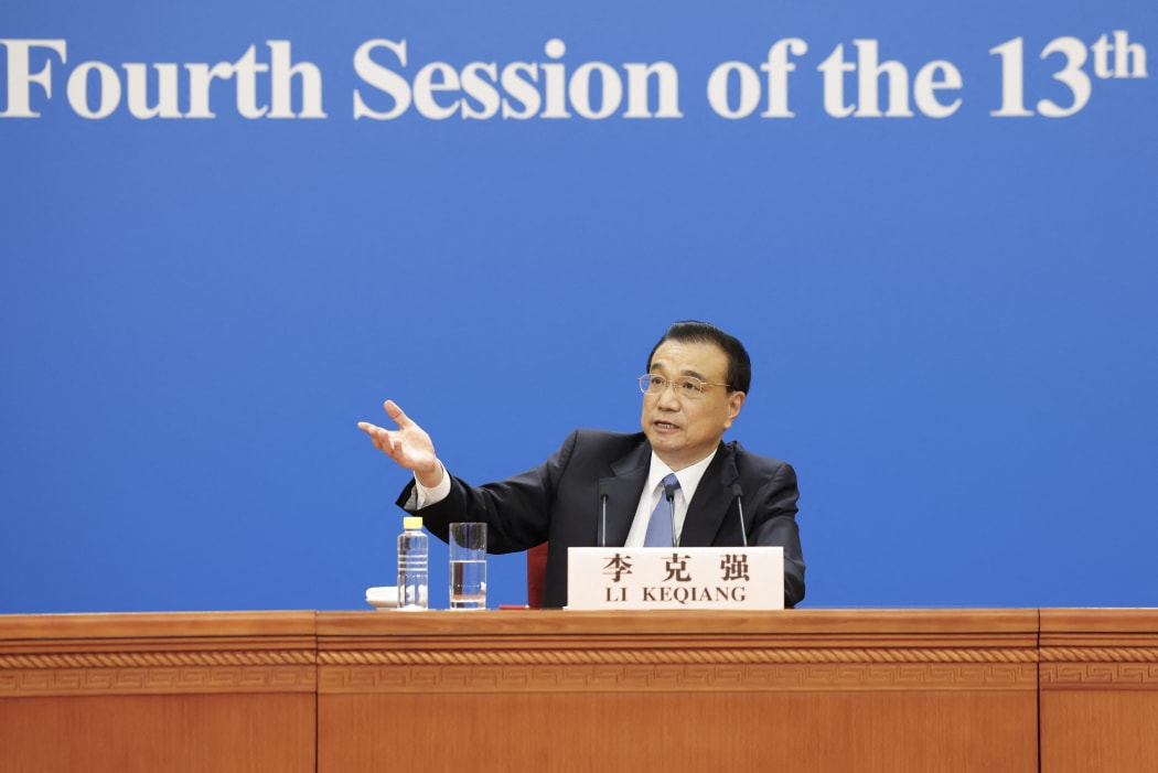 Chinese Premier Li Keqiang meets the press after the closing of the fourth session of the 13th National People's Congress at the Great Hall of the People in Beijing, capital of China, March 11, 2021.