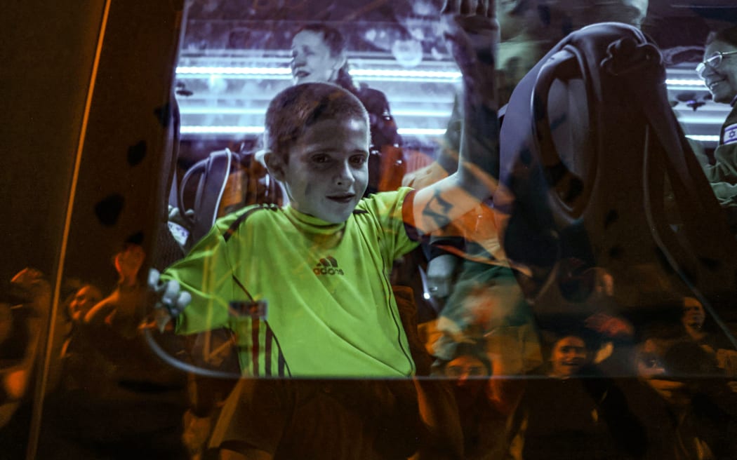Hostage Tal Almog-Goldstein stands in a bus transporting him to an army base in Ofakim in southern Israel after he was released by Hamas on 26 November 2023.