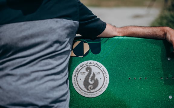 A surfboard bench in memory of tour guide Hayden Marshall-Inman whose body has not been recovered since the Whakaari White Island eruption.