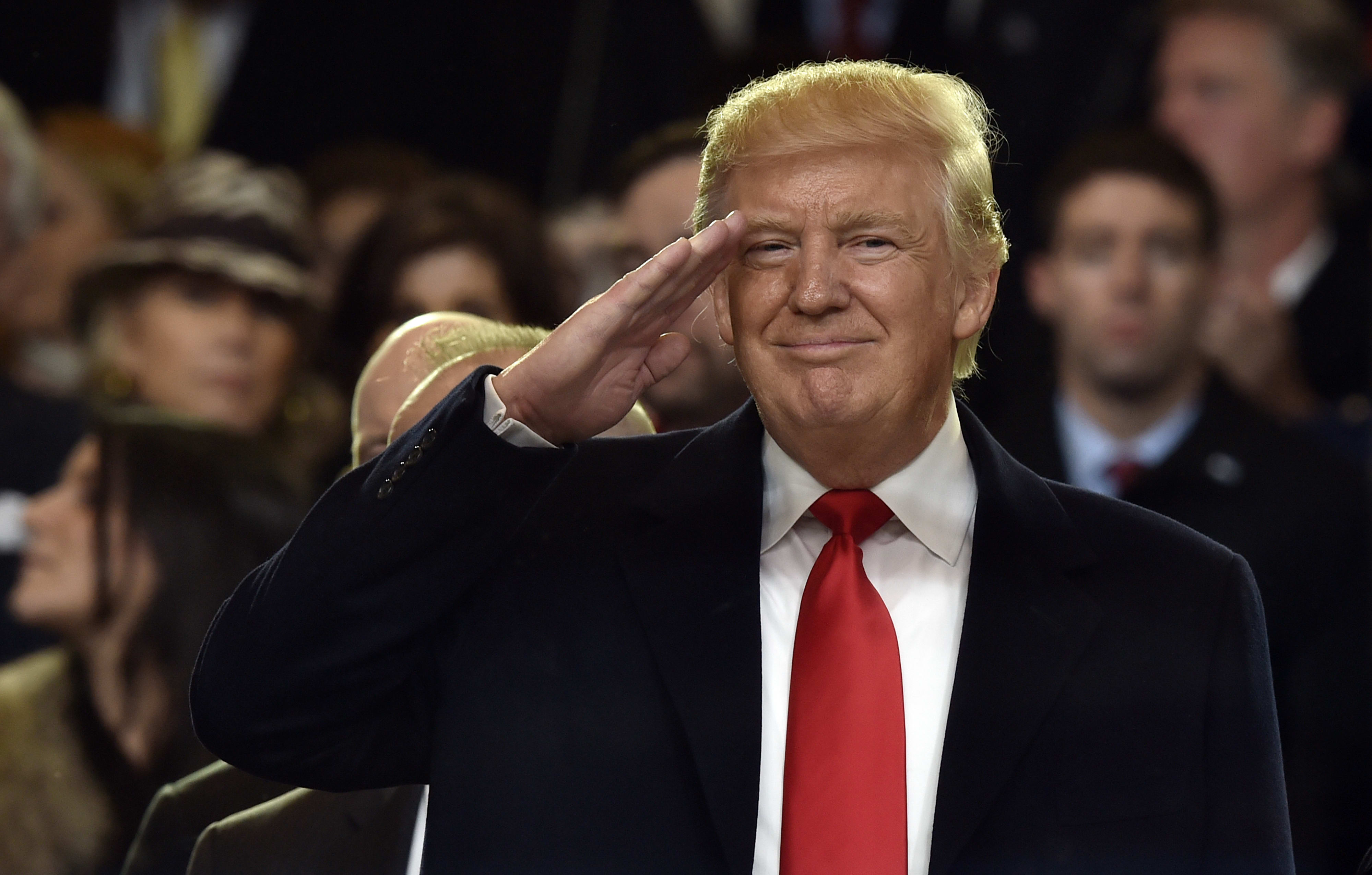 President Donald Trump salutes during the inauguration parade.