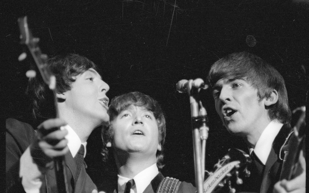 The Beatles - Paul McCartney, John Lennon and George Harrison singing during their 1964 Wellington Concert
