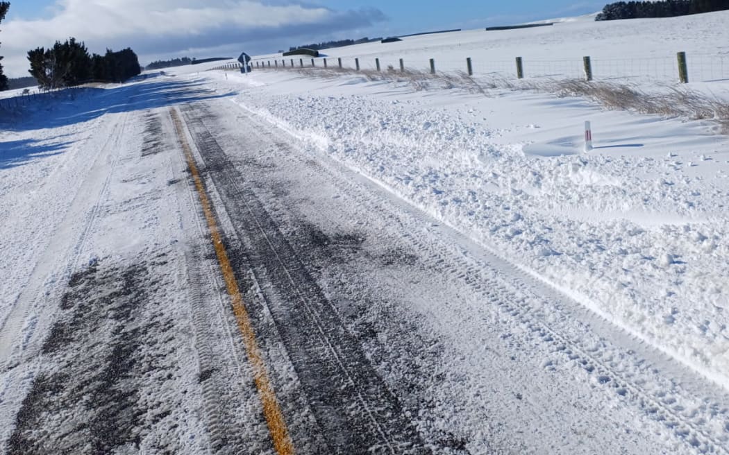 Strong winds are blowing snow onto the closed section of State Highway 87, near Clarks Junction this morning