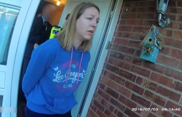 A handout image taken from police bodycam footage released by Cheshire Constabulary police force in Manchester on August 17, 2023, shows the nurse Lucy Letby being arrested at home in Chester on July 3, 2018. Lucy Letby was on August 18, 2023, found guilty of murdering seven newborn babies and trying to murder six others at the hospital neonatal unit where she worked, becoming the UK's most prolific killer of children. Letby, 33 -- on trial since October 2022 -- was accused of injecting her young victims, who were either sick or born prematurely, with air, overfeeding them milk and poisoning them with insulin. (Photo by Cheshire Constabulary / AFP) / RESTRICTED TO EDITORIAL USE - MANDATORY CREDIT  " AFP PHOTO / CHESHIRE CONSTABULARY/ HANDOUT "  -  NO MARKETING NO ADVERTISING CAMPAIGNS   -   DISTRIBUTED AS A SERVICE TO CLIENTS  - RESTRICTED TO EDITORIAL USE - MANDATORY CREDIT  " AFP PHOTO / Cheshire Constabulary/ Handout "  -  NO MARKETING NO ADVERTISING CAMPAIGNS   -   DISTRIBUTED AS A SERVICE TO CLIENTS /