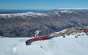 A skiier carves up the slopes at Cardrona Alpine Resort.
