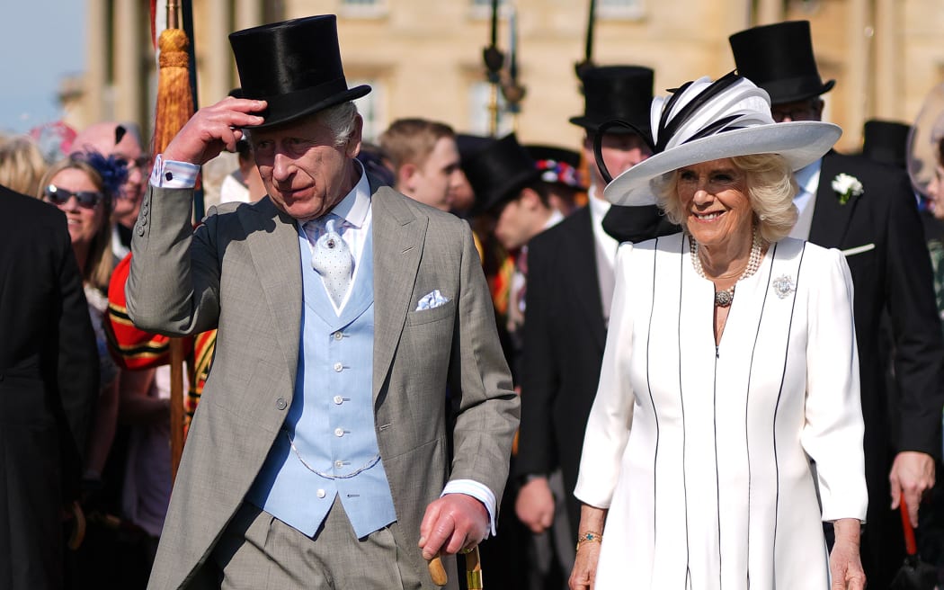 Britain's King Charles III and Britain's Queen Camilla attend a Royal Garden Party at Buckingham Palace, central London, on May 8, 2024.