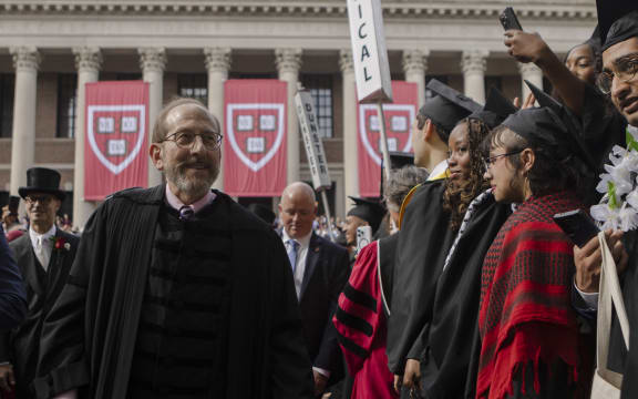Harvard President Alan Garber walks the Tercentenary Theatre processional through Harvard Yard on May 28, 2025 in Cambridge, Massachusetts. The joyous occasion unfolds amid escalating tensions between Harvard and the Trump administration, which has ordered the cancellation of federal contracts valued at approximately $100 million.