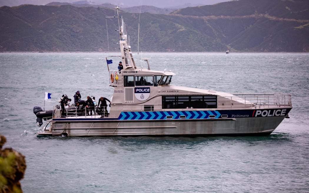 Police dive at Karaka Bay after discovering the body of a diver that went missing