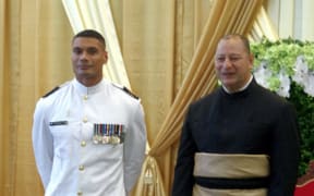 Warrant Officer Seaman Combat Specialist Mark Latu with King Tupou VI during the Tongan ruler’s recent 60th birthday celebrations.