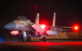This handout picture released by the Israeli Army on April 14, 2024 shows an Israeli Air Force fighter aircraft at an undisclosed airfield reportedly after a mission to intercept incoming airborne threats. Israel's military spokesperson said "99 percent" of the "300 threats" launched by Iran were intercepted.