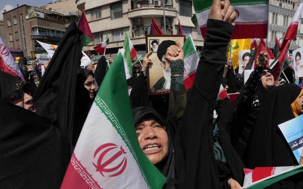 FILE - Iranian worshippers chant slogans during an anti-Israeli gathering after Friday prayers in Tehran, Iran, Friday, April 19, 2024. The apparent crash of a helicopter carrying Iranian President Ebrahim Raisi, the country's foreign minister and other top officials is likely to reverberate across the Middle East. Tensions have soared since the start of the Israel-Hamas war, and Israel and Iran directly traded fire for the first time ever in April. (AP Photo/Vahid Salemi, File)