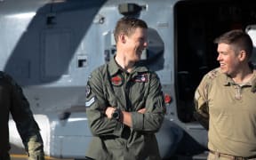 Jase Denharder (left) was the first person the two trampers saw when he was winched down from a helicopter not far above them.