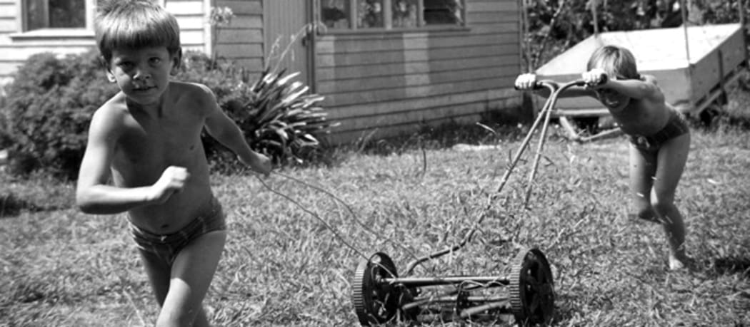 Mowing the lawns on a hot, sunny weekend in 1970's