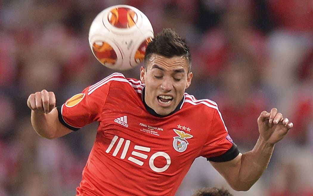 Benfica's Nicolas Gaitan fights for the ball.