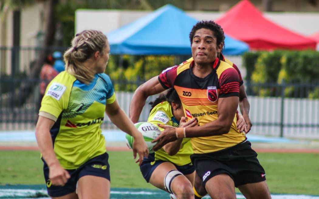 PNG Palais captain Joanne Lagona takes on the Australian defence.