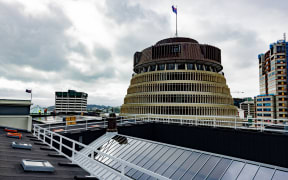 The glass roof of Parliament House's Legislative Council Chamber (foreground) and the Beehive beyond.