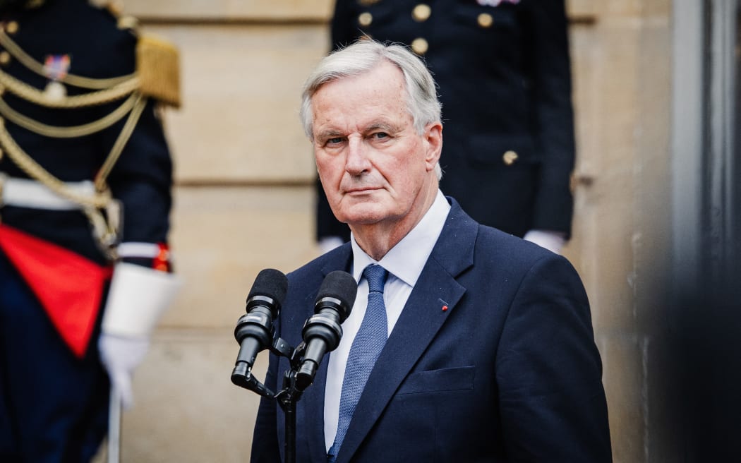 France s Prime Minister Michel Barnier at the handover ceremony to the new Prime Minister in the courtyard of the Hotel de Matignon in Paris, France on September 5, 2024. (Photo by Amaury Cornu / Hans Lucas / Hans Lucas via AFP)