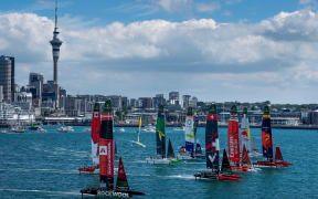 The fleet led by Spain SailGP Team helmed by Diego Botin ahead of Emirates Great Britain SailGP Team, Switzerland SailGP Team and Red Bull Italy SailGP Team start racing in front of the city skyline on Race Day 1 of The Rolex SailGP 2025 Championship ITM New Zealand Sail Grand Prix in Auckland, New Zealand. Saturday 18 January 2025. Photo: Bob Martin for SailGP. Handout image supplied by SailGP