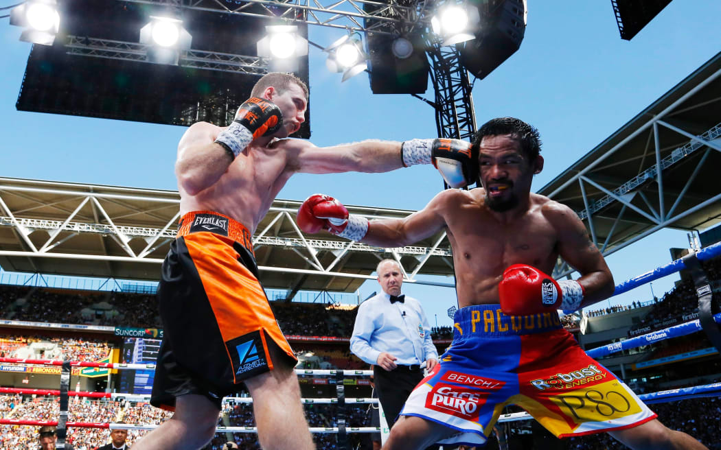 Australian Jeff Horn (L) connects with Filipino boxer Manny Pacquiao's (R) head in the "Battle of Brisbane".