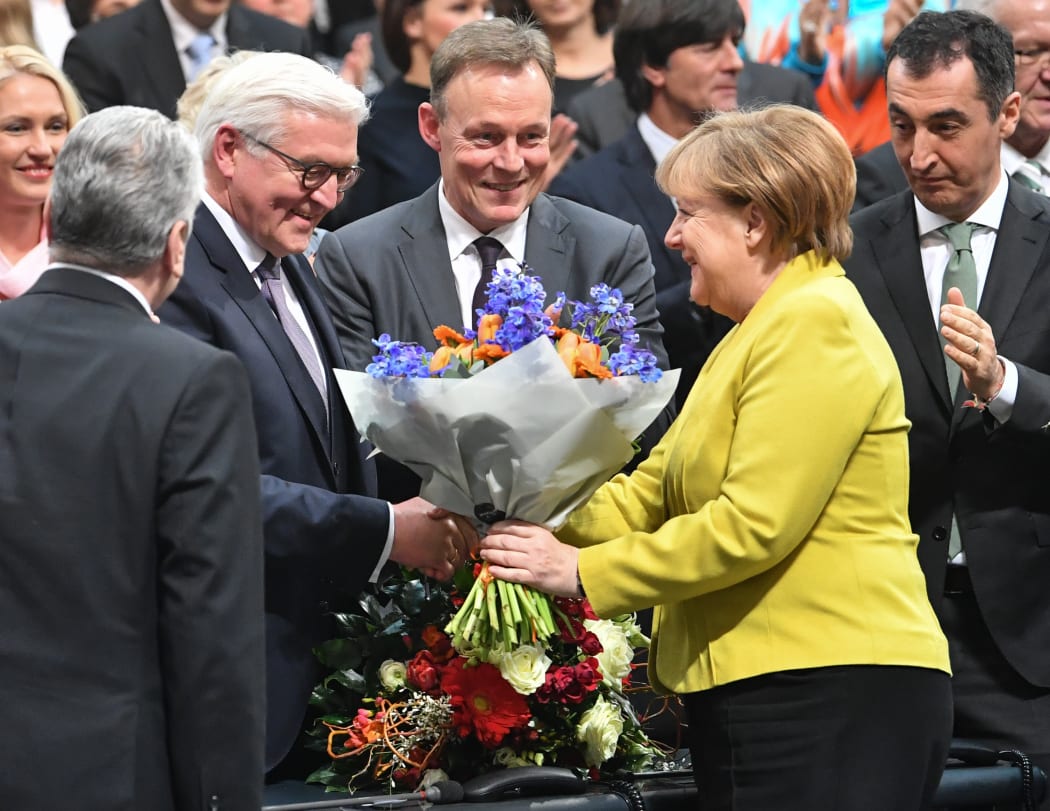 Chancellor Angela Merkel congratulates Germany's newly-elected President, Frank-Walter Steinmeier