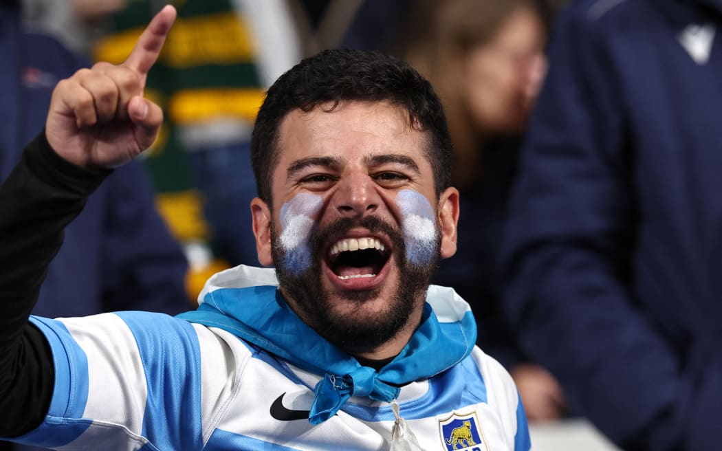 An Argentina's supporter poses ahead of the France 2023 Rugby World Cup semi-final match between Argentina and New Zealand at the Stade de France in Saint-Denis, on the outskirts of Paris, on October 20, 2023. (Photo by Anne-Christine POUJOULAT / AFP)