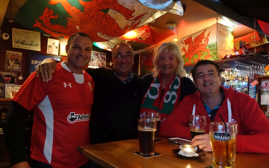 Andron Abdul, Robert Barker, and Elaine Barker at the Welsh Dragon Bar with another patron.