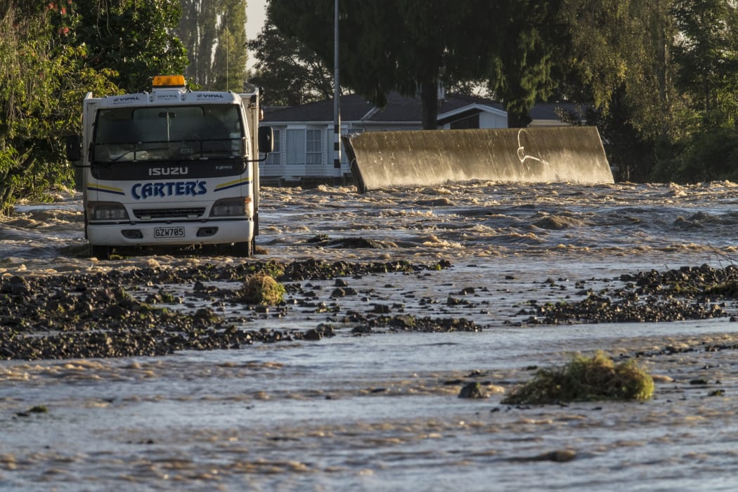 The morning after the town of Edgecumbe was flooded by a burst stopbank.  The displaced wall that was supposed to prevent the river Rangitaiki from flooding the town sits in the middle of College Road.  Friday 7 April 2017