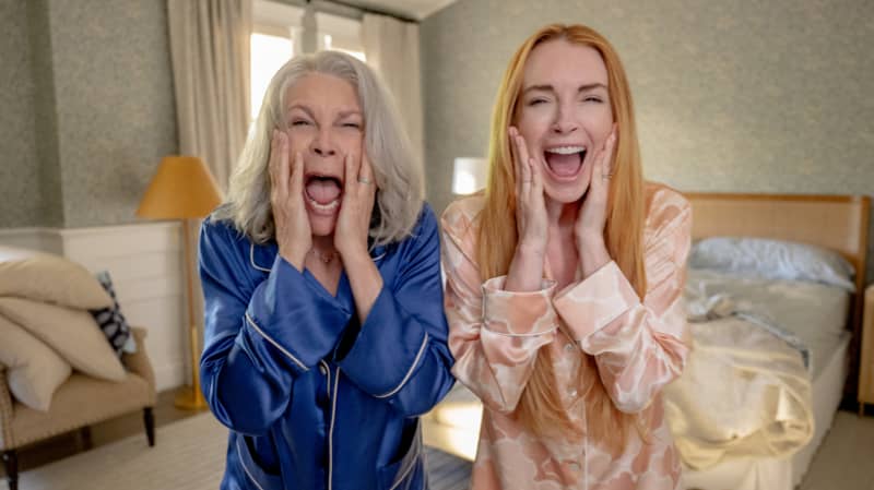 Lindsay Lohan and Jamie Lee Curtis screaming as they wake up in swapped bodies in the film Freakier Friday.