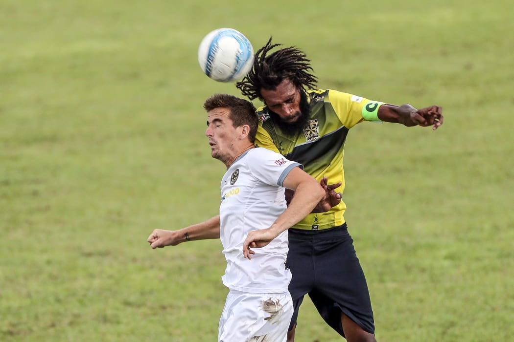 Erakor Golden Star's Jason Thomas wins the ball over Team Wellington's Angus Kilkolly. OFC Champions League 2019, Group C, Erakor Golden Star v Team Wellington.