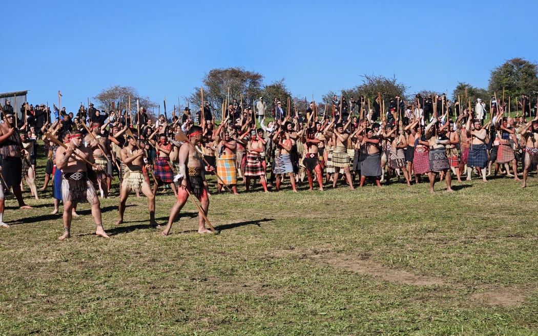 Members of Te Aka Rauwhero welcome Government representatives to Ōrākau.