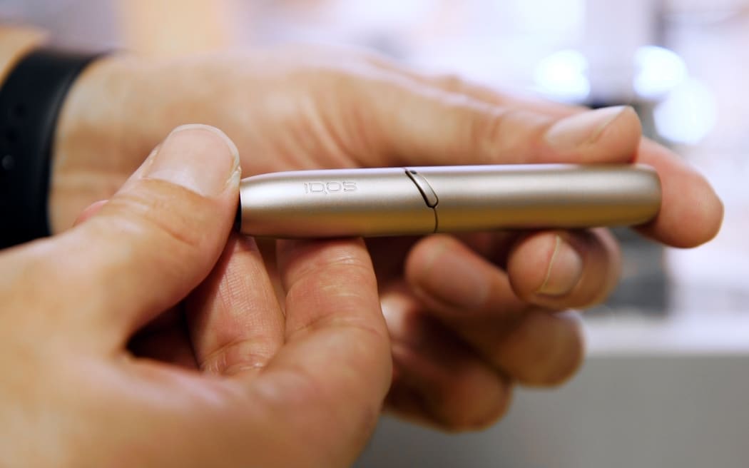 IQOS is a hybrid between an e-cigarette and a traditional cigarette.