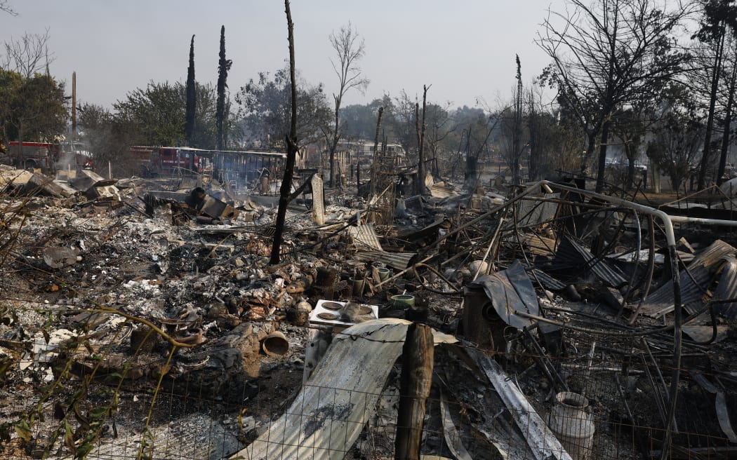 CHINESE CAMP, CALIFORNIA - SEPTEMBER 03: A view of homes destroyed by the 6-5 Fire in the TCU September Lightning Complex on September 03, 2025 in Chinese Camp, California. Nearly 12,000 acres have burned, and several structures were destroyed in the historic gold rush town of Chinese Camp after the 6-5 Fire, which is part of the TCU September Lightning Complex, a series of at least nine fires that were sparked by lightning. The TCU Lightning Complex is currently zero percent contained.   Justin Sullivan/Getty Images/AFP (Photo by JUSTIN SULLIVAN / GETTY IMAGES NORTH AMERICA / Getty Images via AFP)