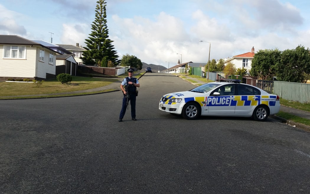 Police continue to stand guard in the area on the second day of the stand-off.