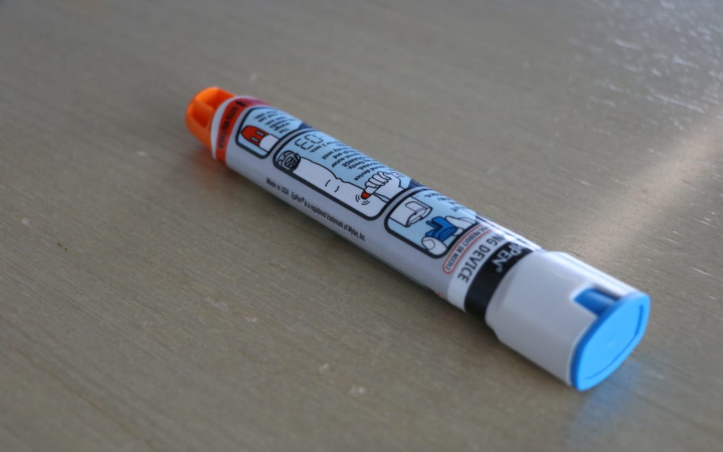An EpiPen on a table.