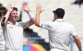 Matt Henry celebrates taking a wicket.