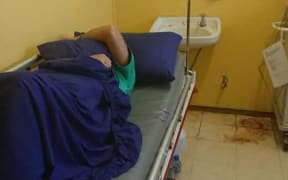 The sick refugee at Lorengau Hospital.