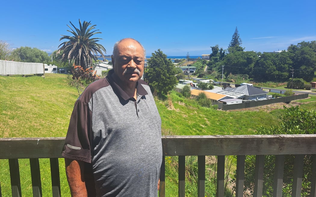 Robert Holmes at his home looking over the Maketū township.