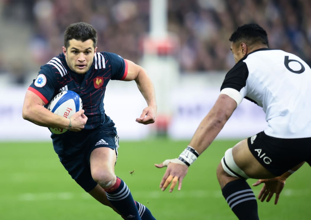 France's Brice Dulin and All Black Jerome Kaino.