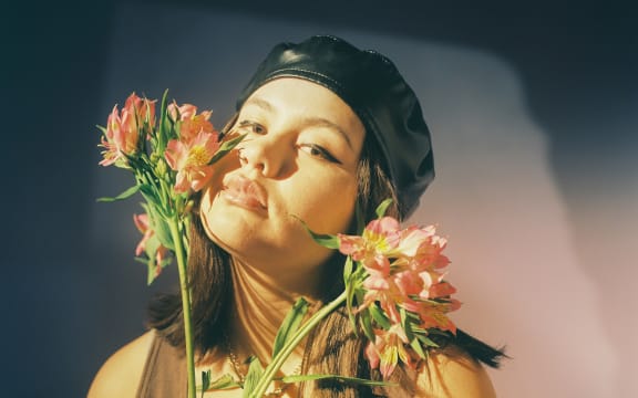 Paige, sniffing flowers