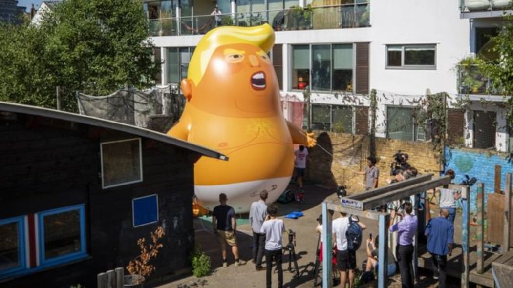 Campaigners tried out the inflatable baby at Martin Luther King adventure playground in Islington.