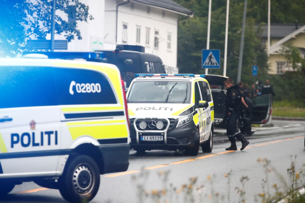 Police vehicles near Norway's al-Noor Islamic Center mosque where a gunman opened fire.