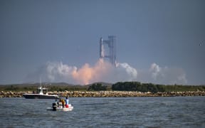 The SpaceX Starship rocket launches from Starbase, Texas, as seen from South Padre Island on May 27, 2025. SpaceX mission control lost contact with the upper stage of Starship as it leaked fuel, spun out of control, and made an uncontrolled reentry after flying halfway around the world, likely disintegrating over the Indian Ocean, officials said. (Photo by Sergio FLORES / AFP)