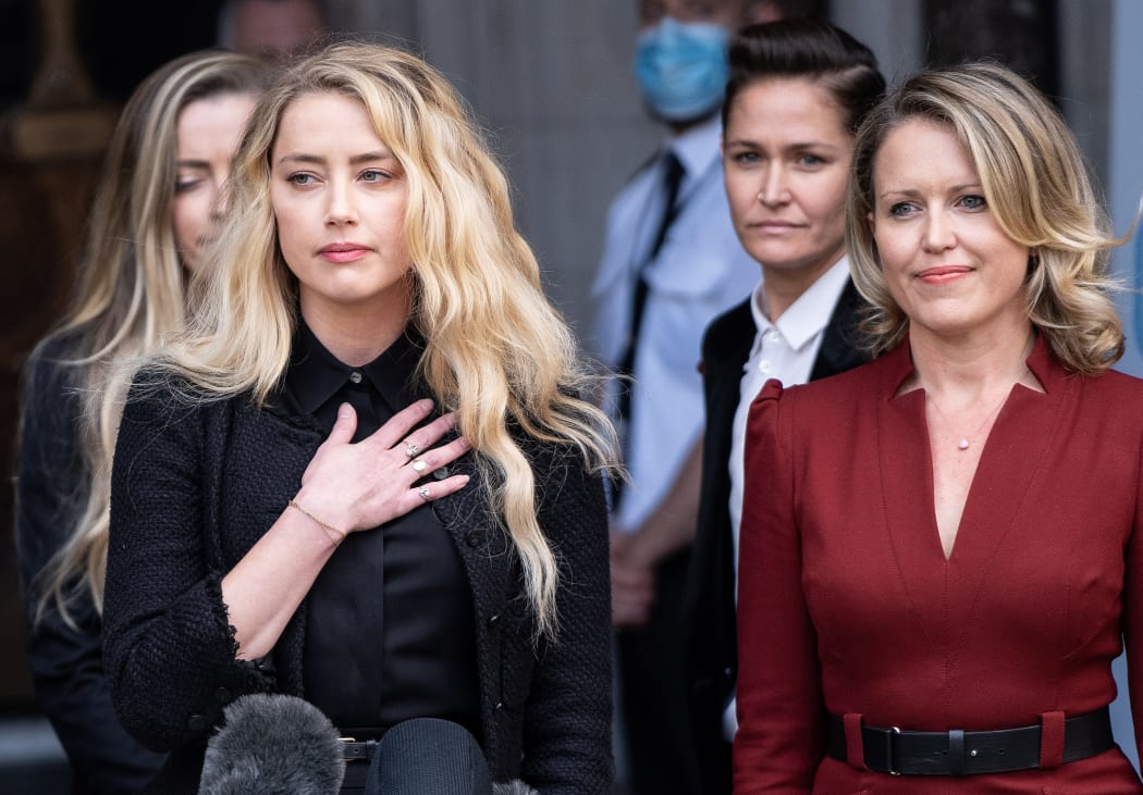 US actress Amber Heard makes a statement to members of the media outside the High Court, following the final day of the libel trial by ex-husband US actor Johnny Depp against News Group Newspapers in London, on July 28, 2020.