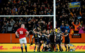 The Otago Highlanders celebrate their close win over the Lions in Dunedin.