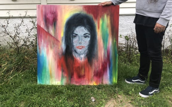 Roy Irwin with his unique painting of Michael Jackson.