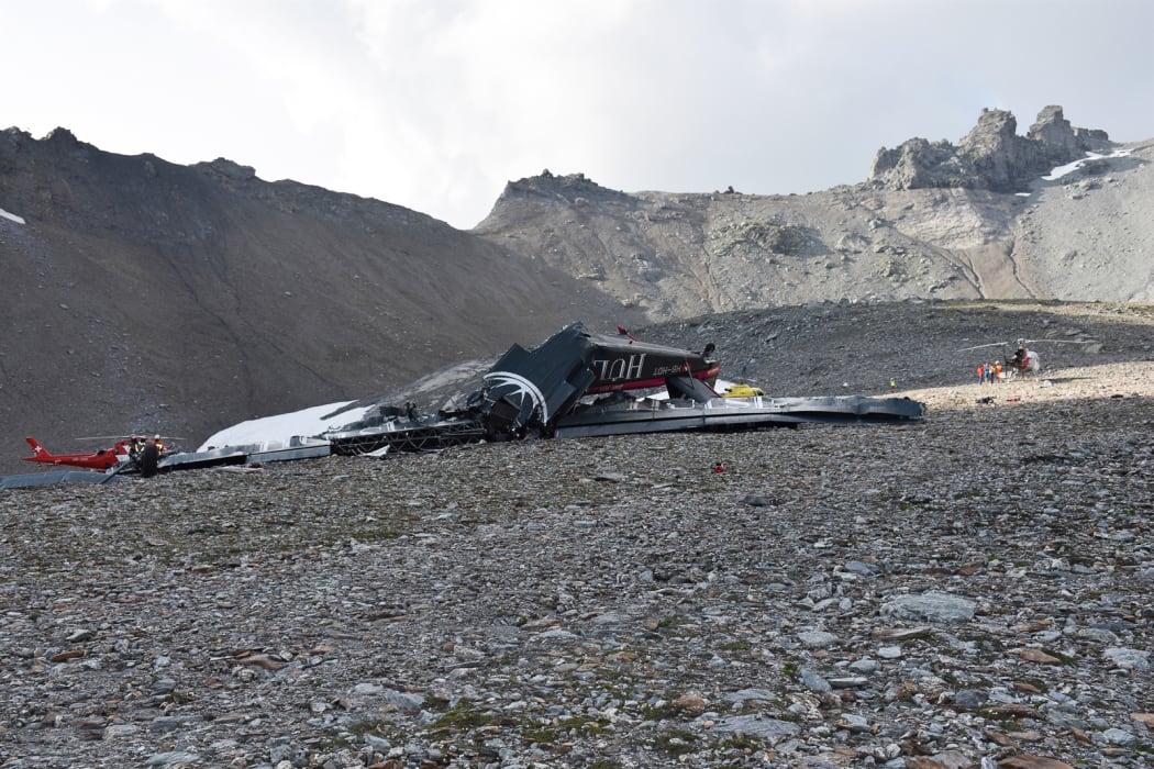 Twenty people are confirmed dead after a vintage World War II aircraft crashed into a Swiss mountainside, police reports said.