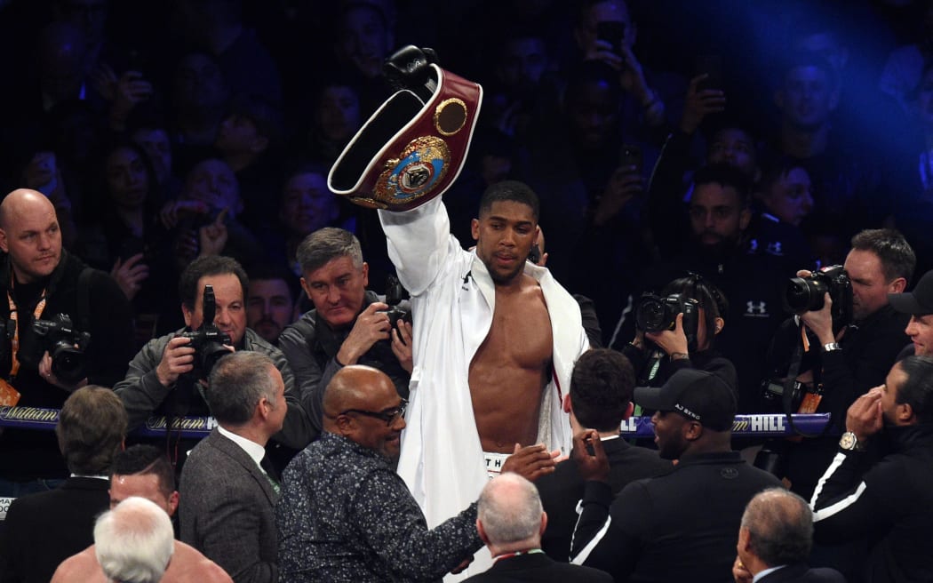 Anthony Joshua of Great Britain celebrates victory over Joseph Parker of New Zealand.