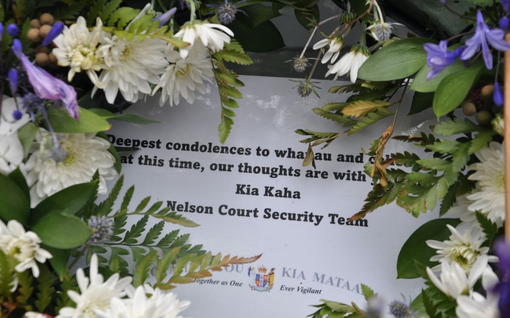 Police officers gather for a minute's silence to remember their colleague Senior Sergeant Lyn Fleming, who died after being struck by a vehicle while patrolling in central Nelson in the early hours of New Years Day.