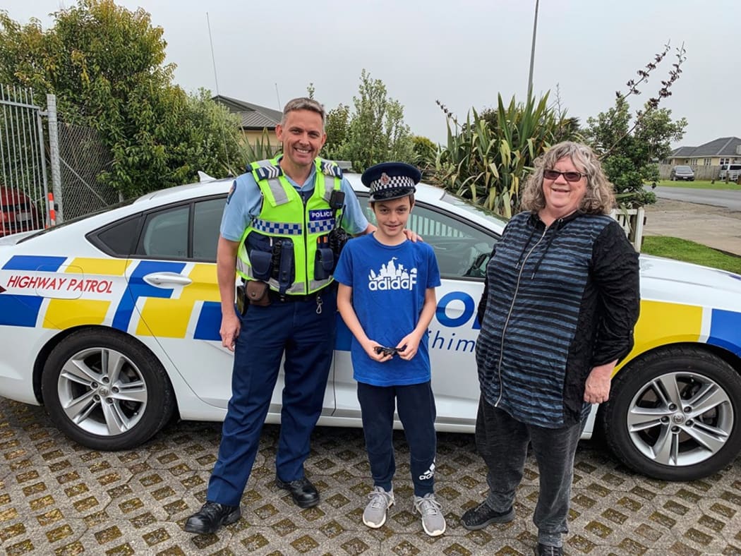 Ryan and Kathie with Sergeant Fleming at the Pokeno station.