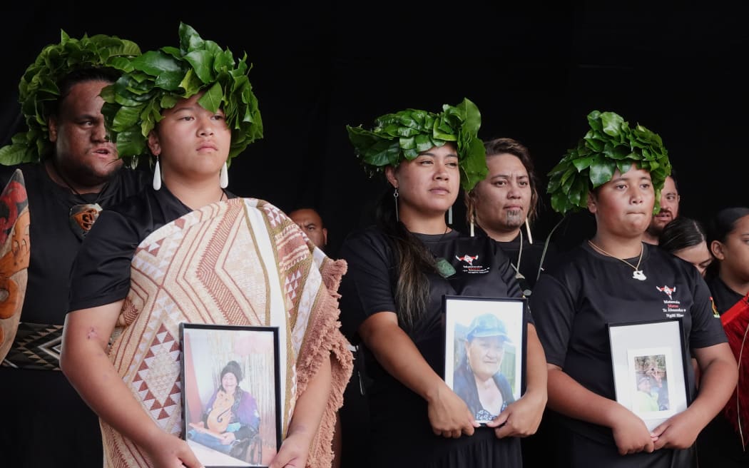 Performers from Waiōmio Marae hold kawe mate in memory of the deceased.
